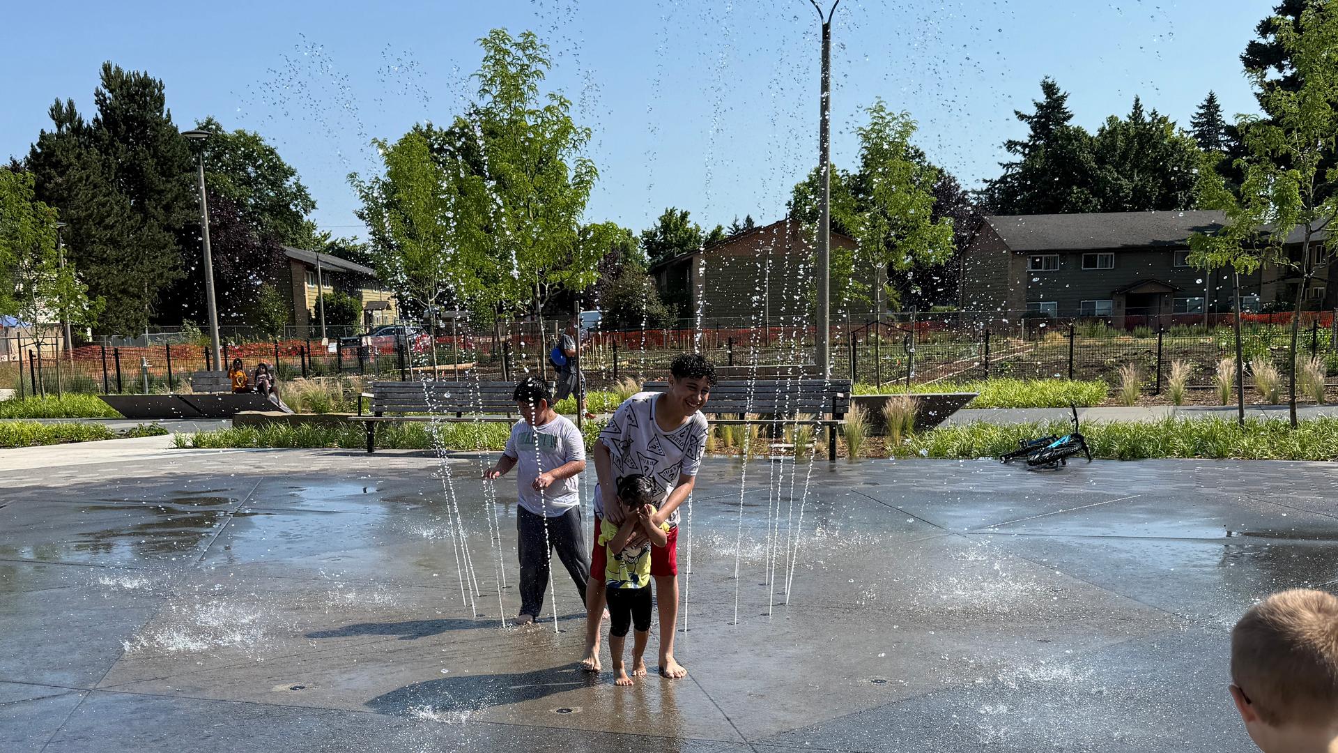Children playing on a splash pad at Mill Park