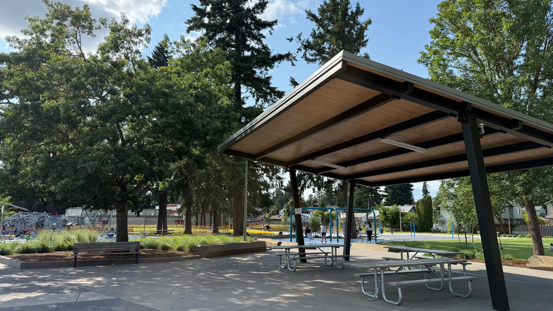 Sheltered picnic tables at Mill Park.